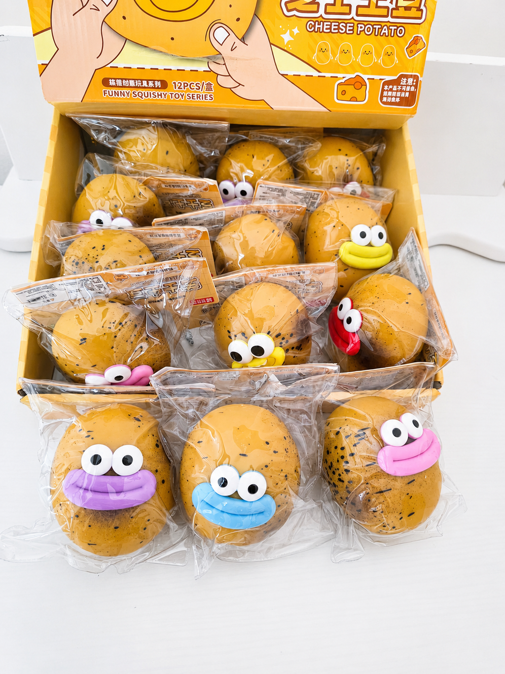 Collection de squishies Cheese Potato kawaii avec visages bleu et rose, jouets anti-stress patate